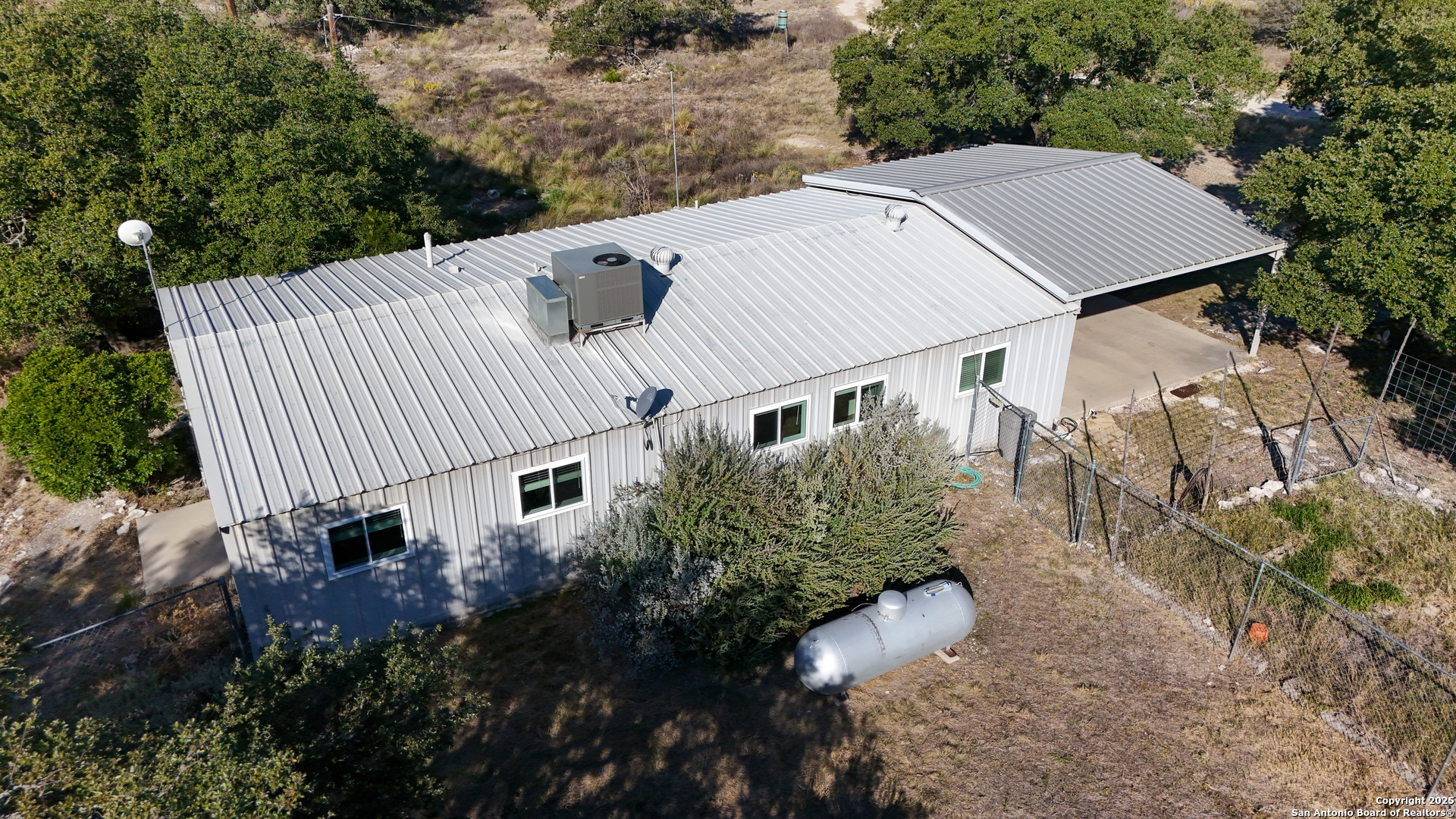 1031 Shin Oak Road Menard, TX 76859 - Photo 2 of 31 a view of a house with a yard and sitting area