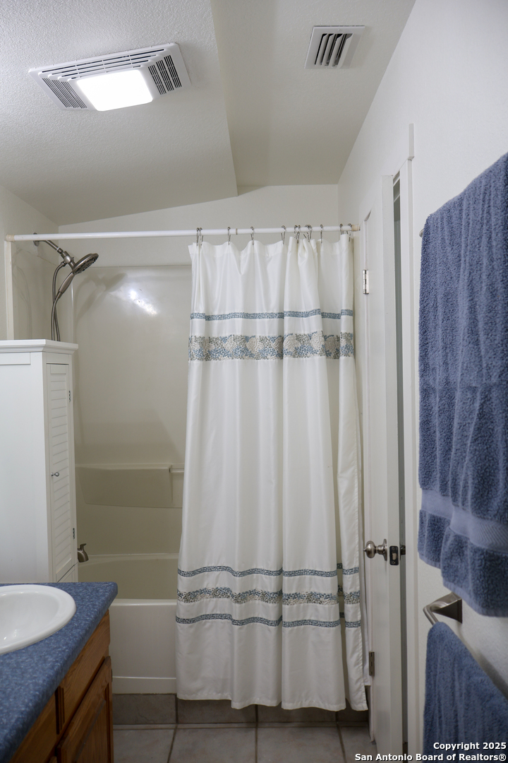 1031 Shin Oak Road Menard, TX 76859 - Photo 21 of 31 a bathroom with a shower and a sink