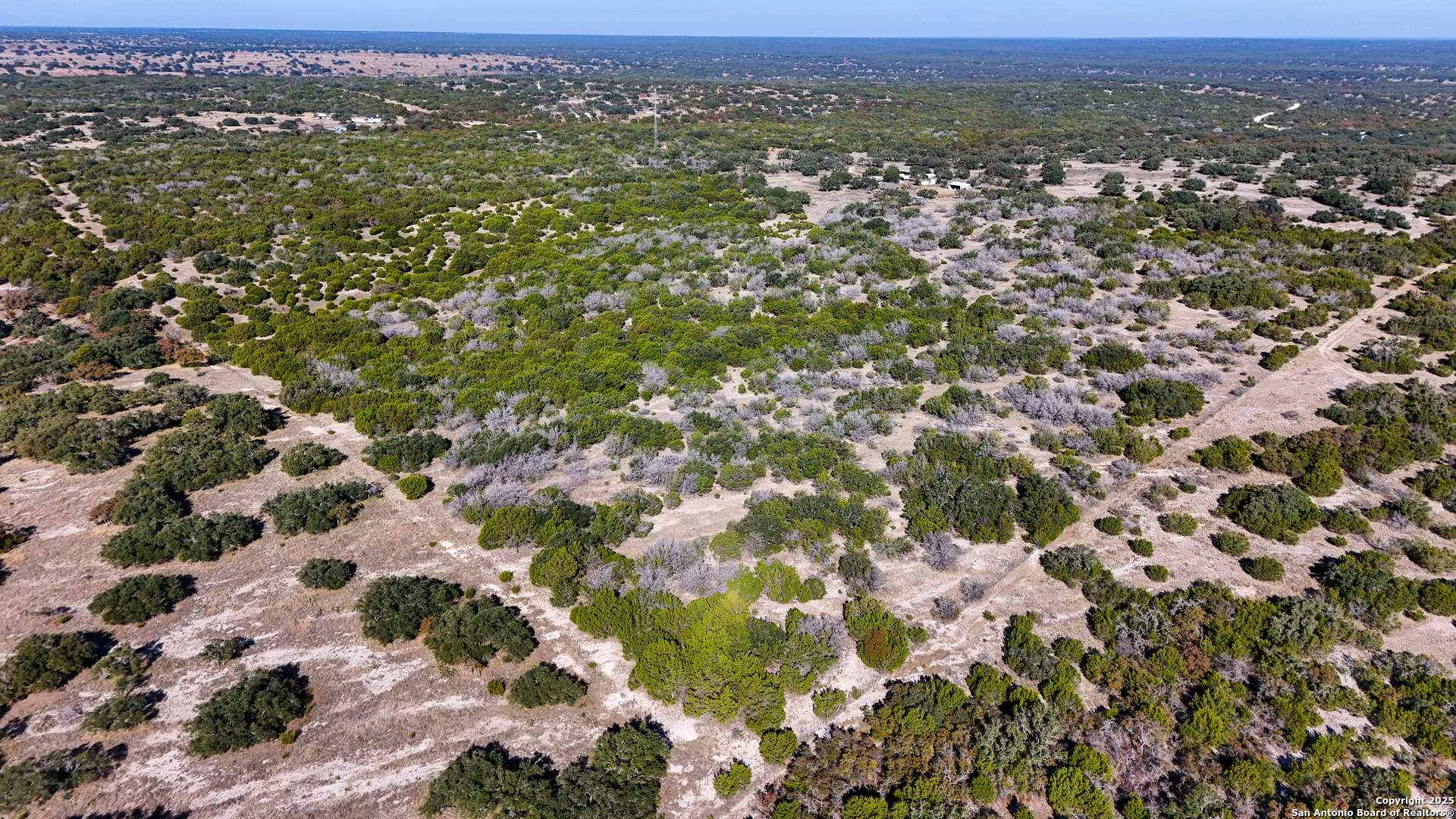 1031 Shin Oak Road Menard, TX 76859 - Photo 27 of 31 an aerial view of residential houses with city view