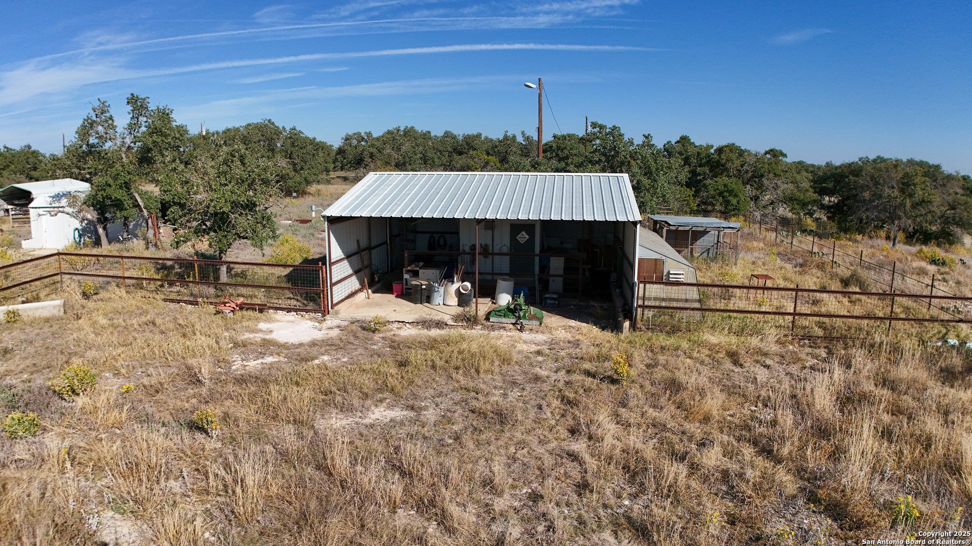 1031 Shin Oak Road Menard, TX 76859 - Photo 7 of 31 a backyard of a house with table and chairs