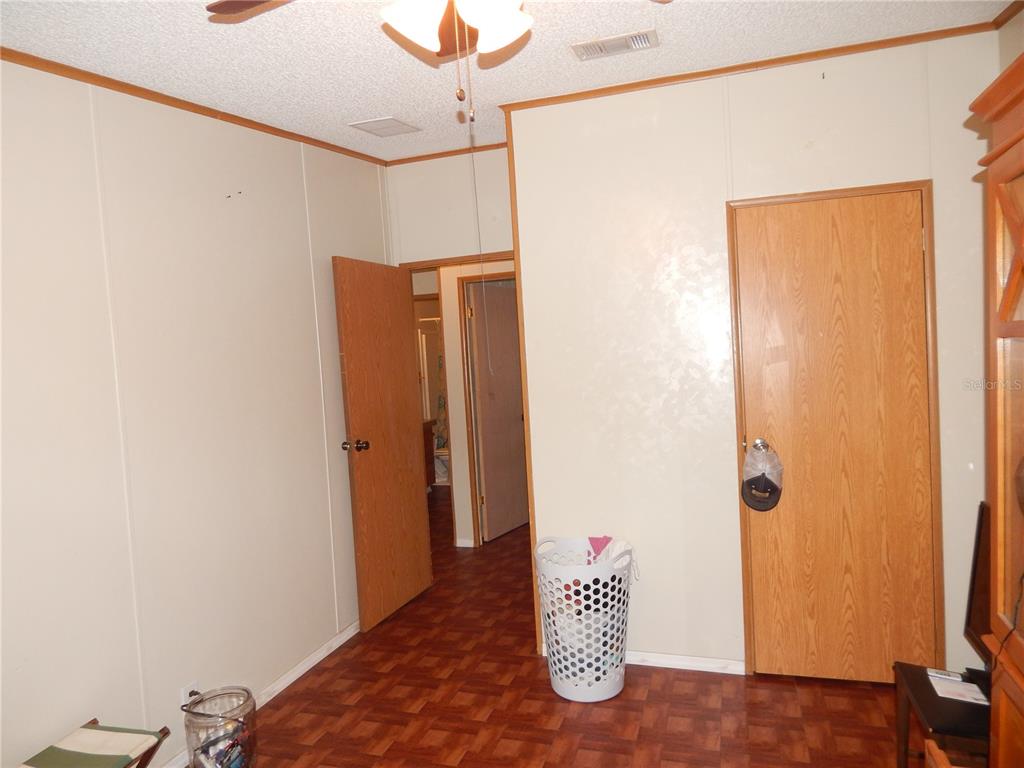 900 Columbia Avenue St. Cloud, FL 34769 - Photo 15 of 19 a view of a room with wooden floor