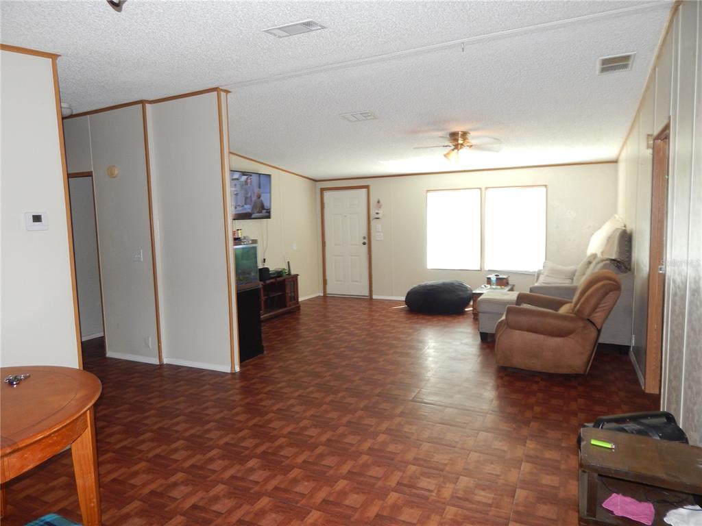 900 Columbia Avenue St. Cloud, FL 34769 - Photo 4 of 19 a living room with furniture and a large window