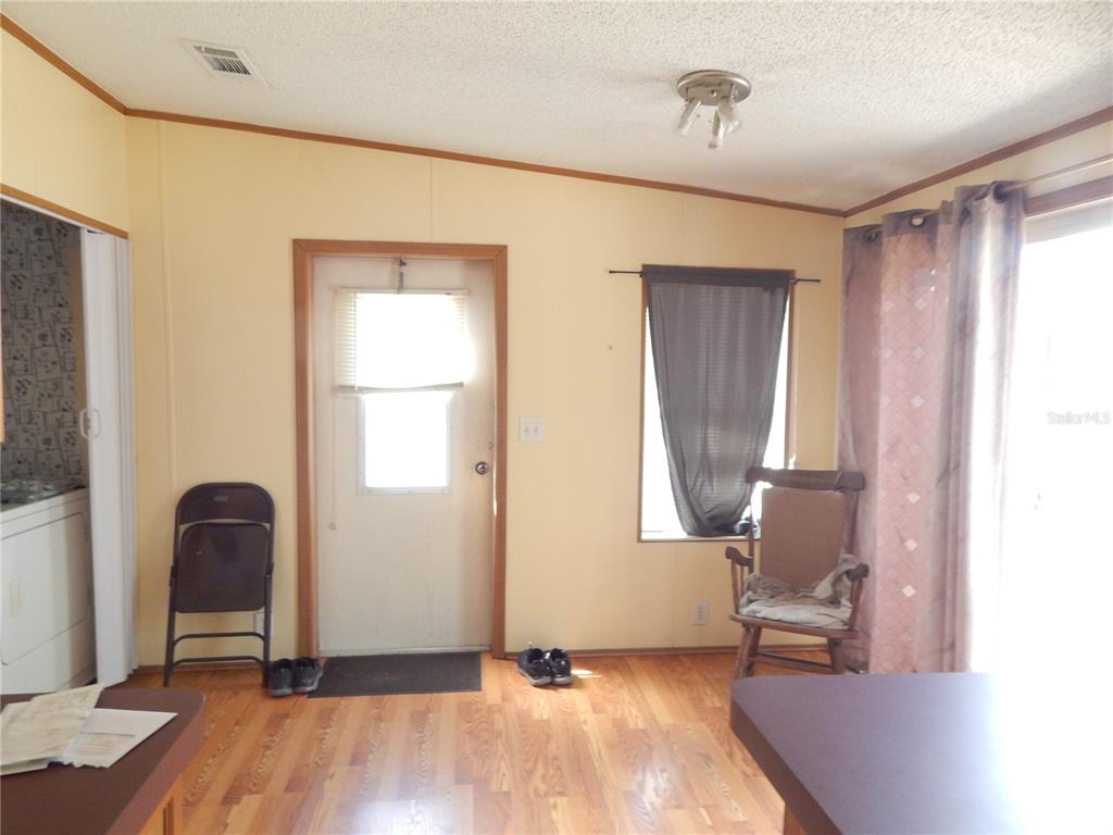 900 Columbia Avenue St. Cloud, FL 34769 - Photo 7 of 19 a view of room with window and wooden floor