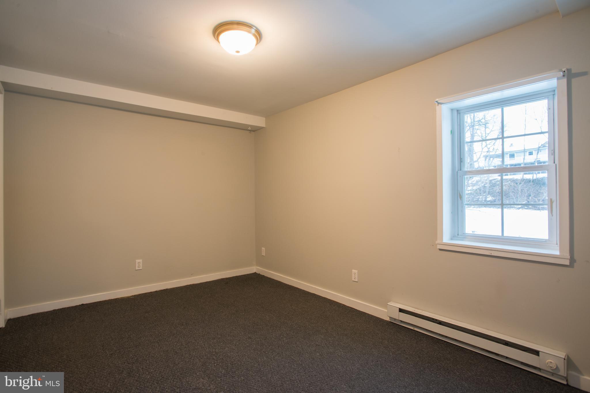 99 East Perry Street Enola, PA 17025 - Photo 12 of 18 an empty room with a window
