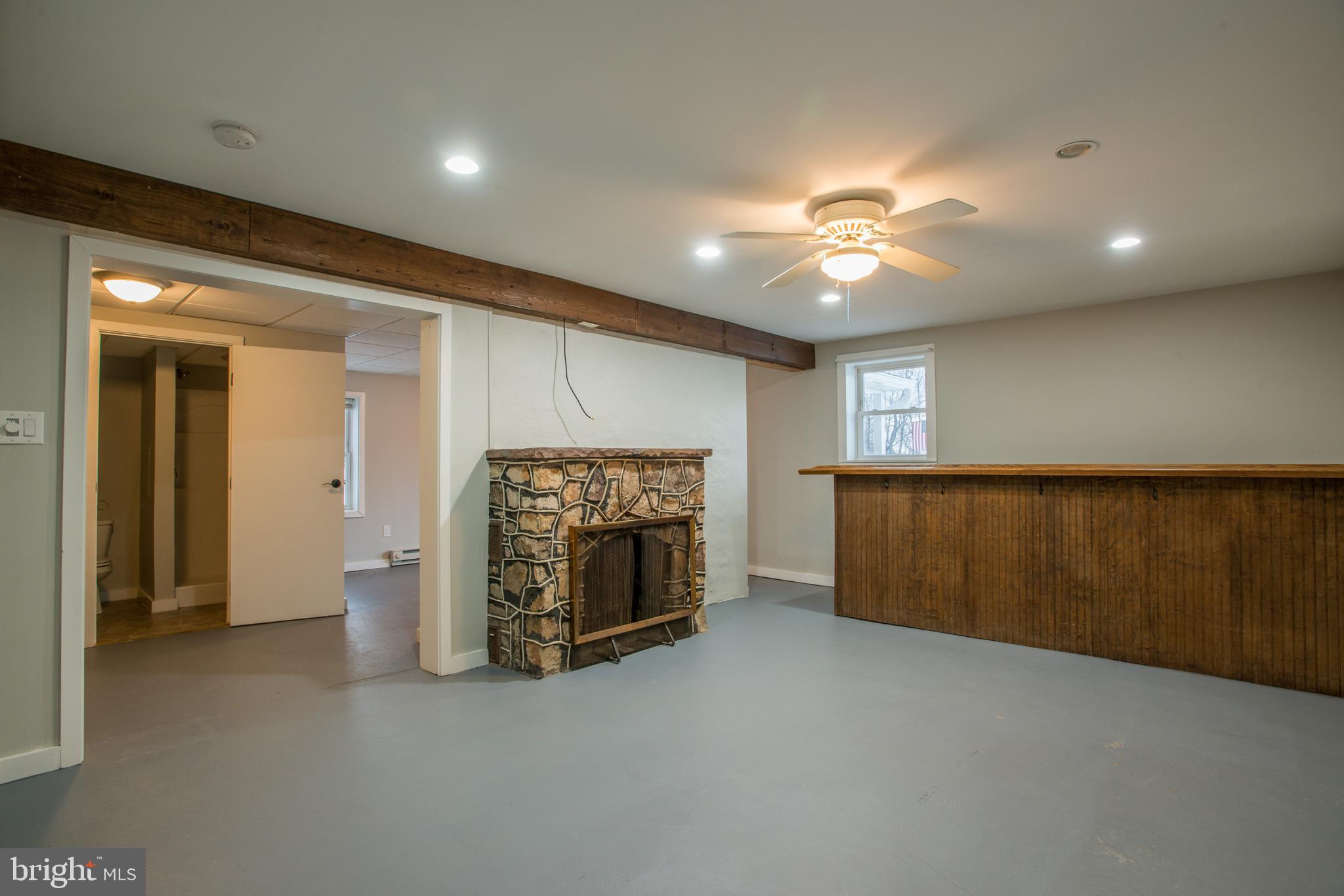 99 East Perry Street Enola, PA 17025 - Photo 16 of 18 a view of empty room with fireplace and fan