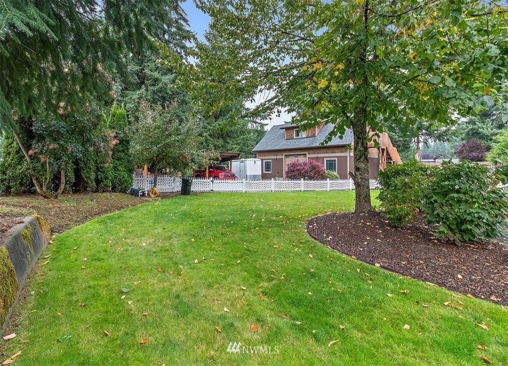 18811 Nutmeg Street Southwest Rochester, WA 98579 - Photo 20 of 25 a view of a house with a yard porch and sitting area