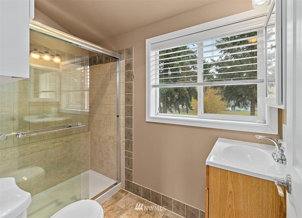 18811 Nutmeg Street Southwest Rochester, WA 98579 - Photo 24 of 25 a bathroom with a sink and a shower
