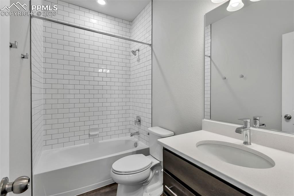 13633 Flurry Heights Colorado Springs, CO 80921 - Photo 11 of 31 a bathroom with a sink toilet and shower