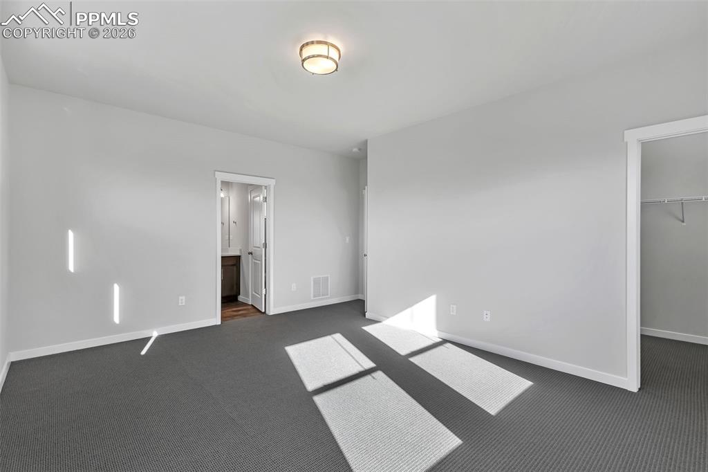 13633 Flurry Heights Colorado Springs, CO 80921 - Photo 14 of 31 a view of an empty room with wooden floor