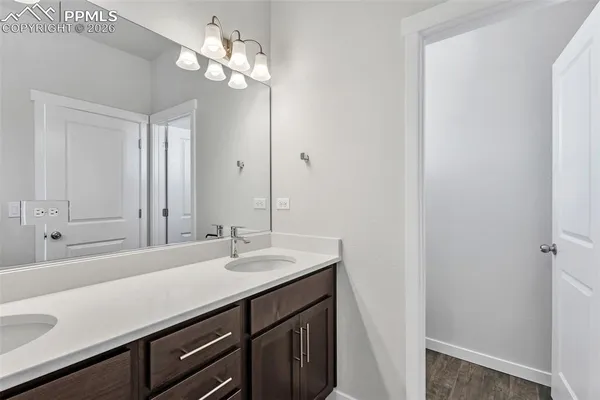 a bathroom with a sink a vanity and a mirror