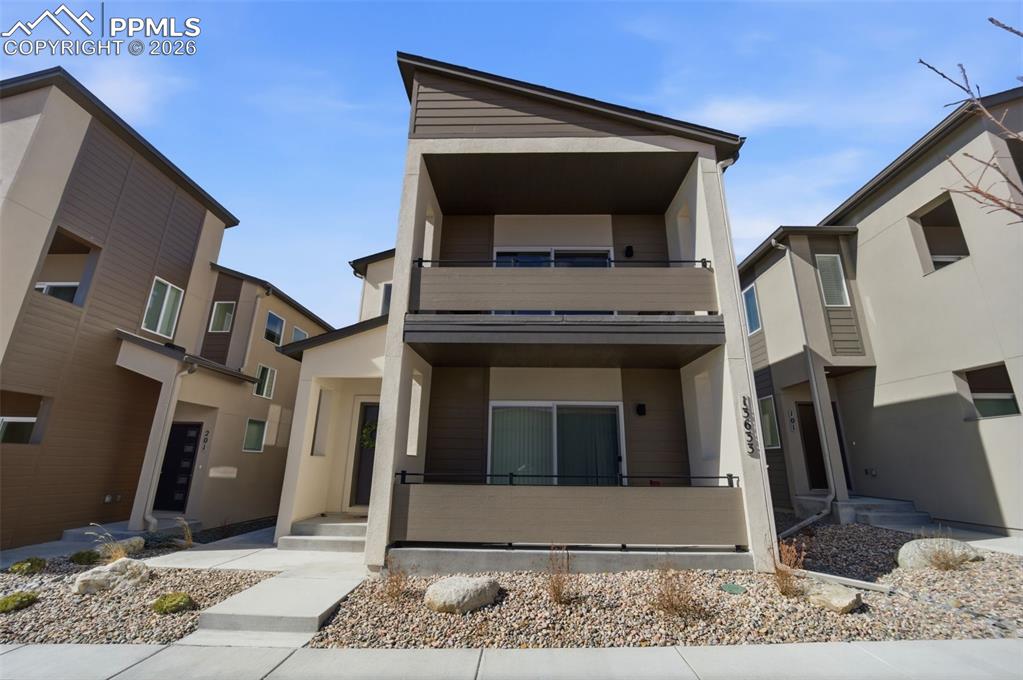 13633 Flurry Heights Colorado Springs, CO 80921 - Photo 2 of 31 a view of a house with a door