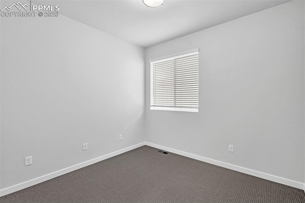 13633 Flurry Heights Colorado Springs, CO 80921 - Photo 24 of 31 an empty room with a window