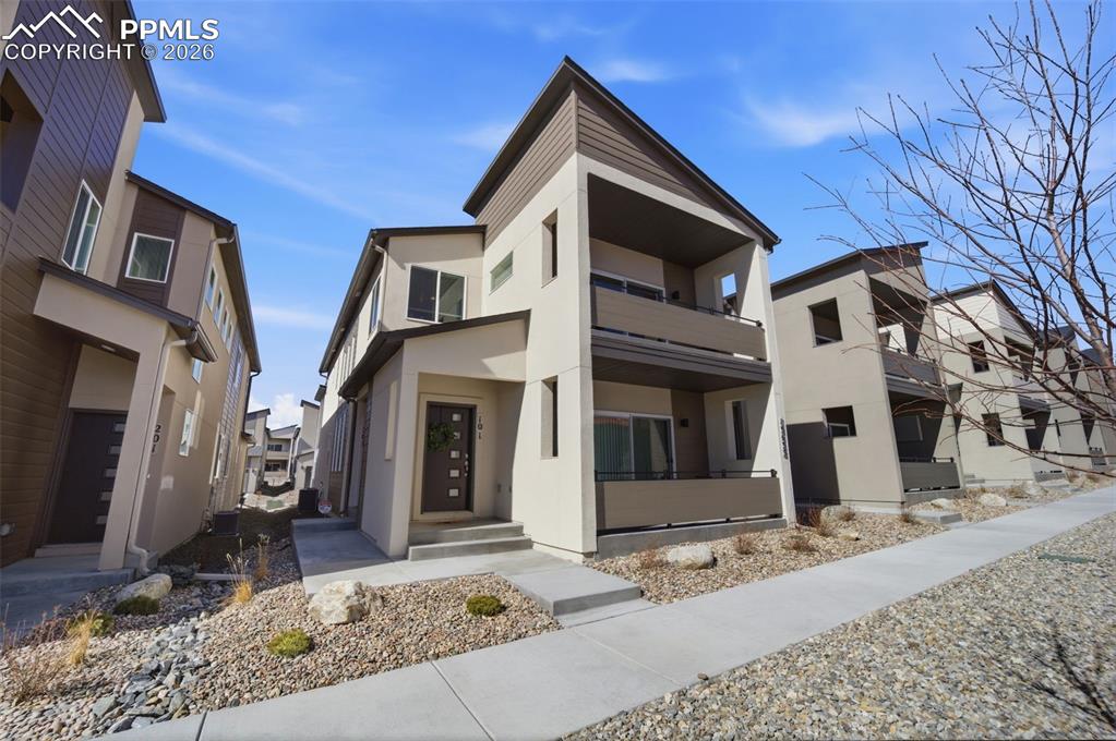 13633 Flurry Heights Colorado Springs, CO 80921 - Photo 3 of 31 a front view of a house with parking
