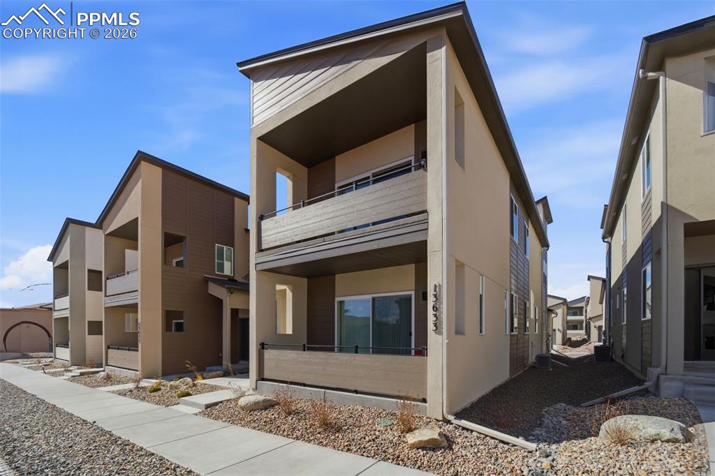 13633 Flurry Heights Colorado Springs, CO 80921 - Photo 4 of 31 a view of an entrance of the building