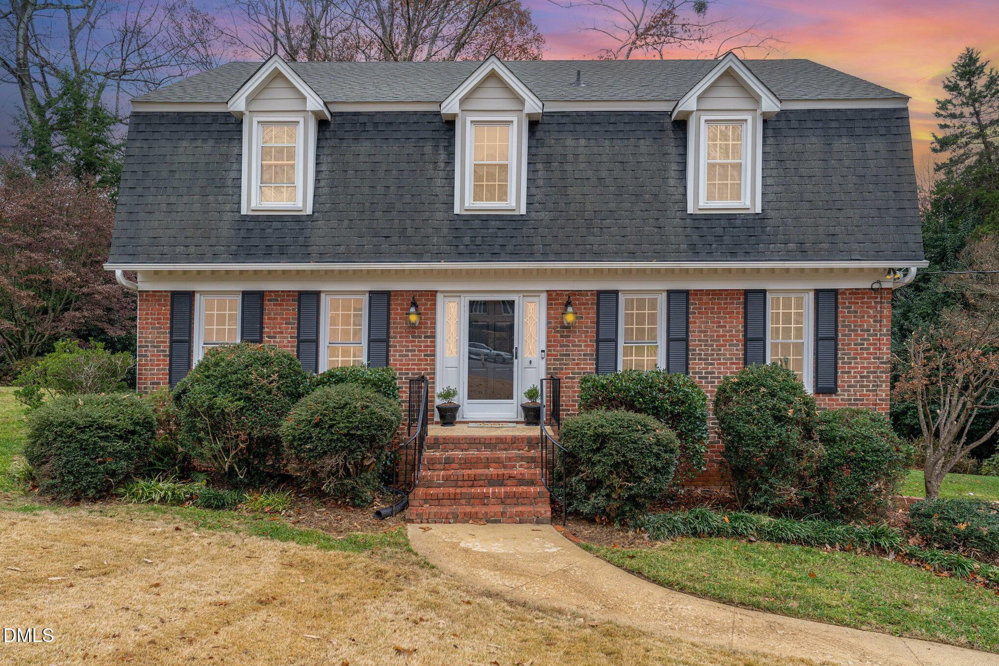 1100 Sudbury Court Raleigh, NC 27609 - Photo 1 of 56 a front view of a house with yard