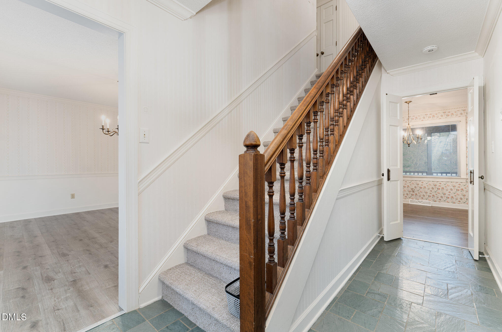 1100 Sudbury Court Raleigh, NC 27609 - Photo 25 of 56 a view of staircase with wooden floor and a rug