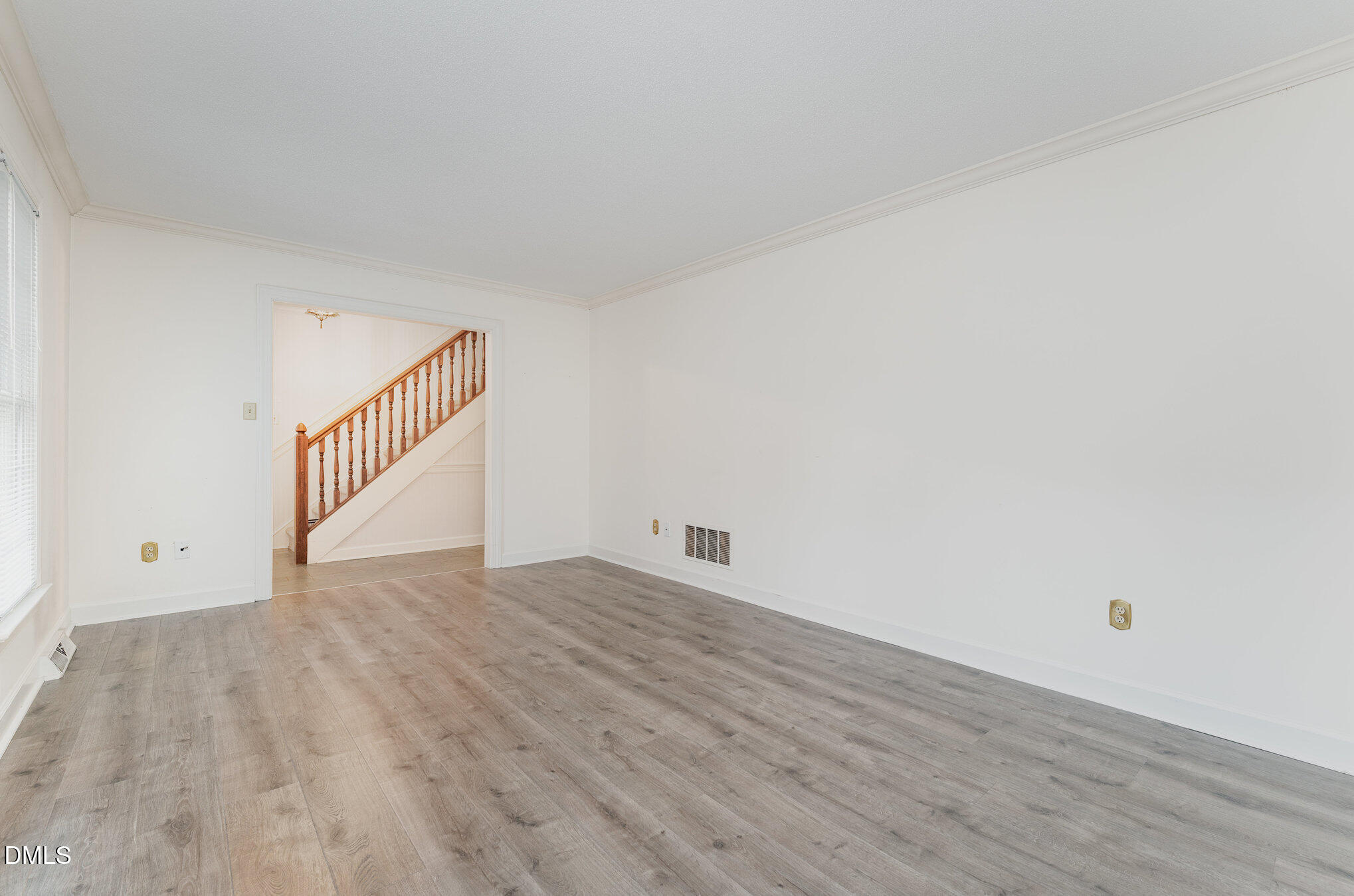1100 Sudbury Court Raleigh, NC 27609 - Photo 27 of 56 a view of an empty room with wooden floor