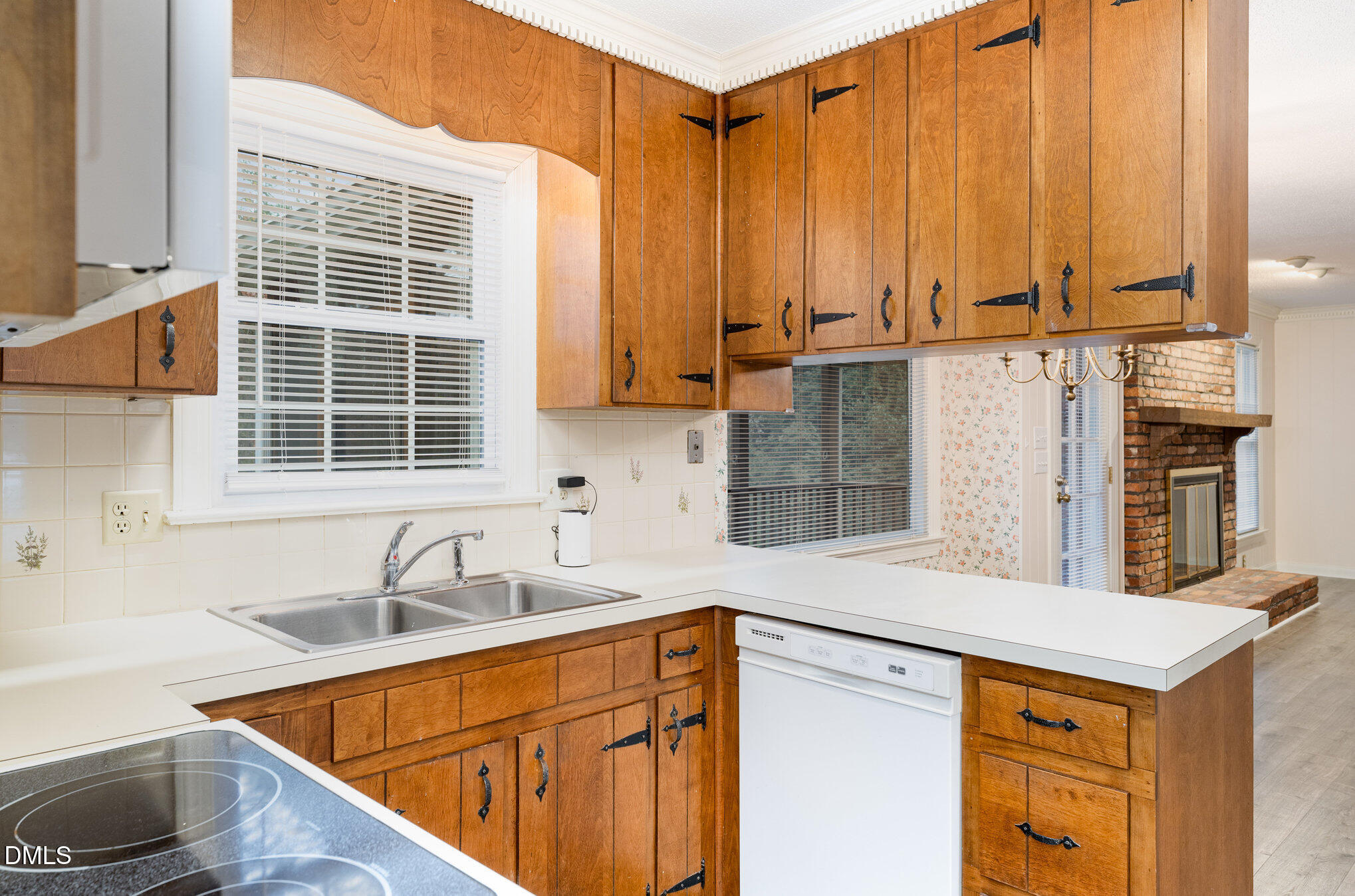 1100 Sudbury Court Raleigh, NC 27609 - Photo 32 of 56 a kitchen with stainless steel appliances a sink and cabinets
