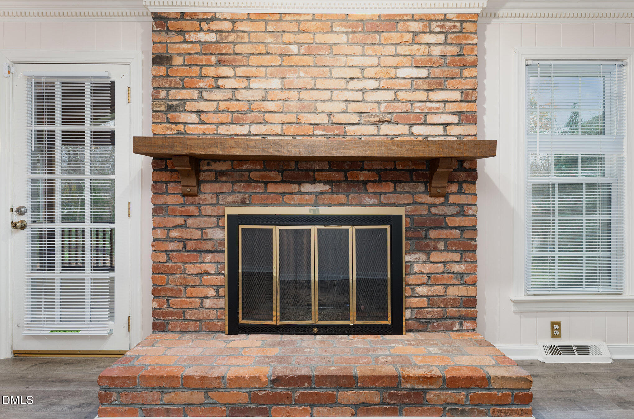 1100 Sudbury Court Raleigh, NC 27609 - Photo 36 of 56 a living room with a fireplace and windows