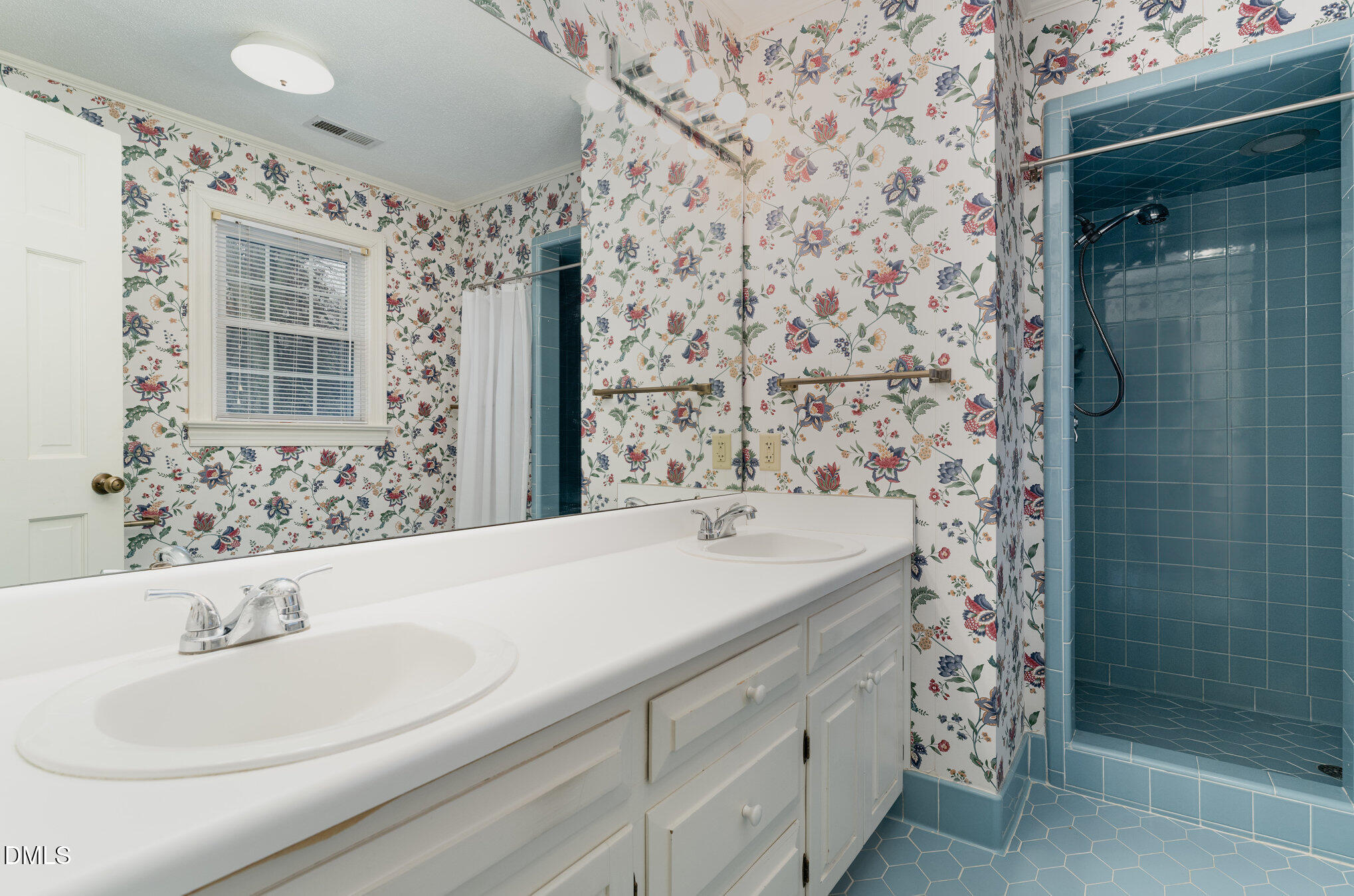 1100 Sudbury Court Raleigh, NC 27609 - Photo 41 of 56 a bathroom with a sink and a mirror