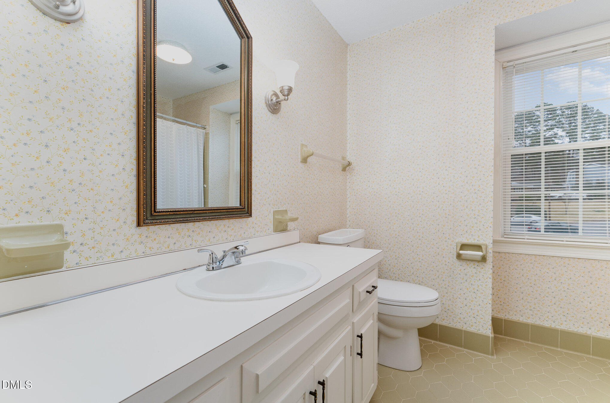 1100 Sudbury Court Raleigh, NC 27609 - Photo 48 of 56 a bathroom with a sink toilet and vanity