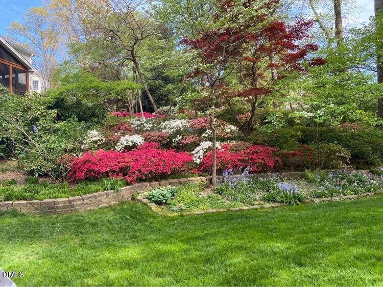 1100 Sudbury Court Raleigh, NC 27609 - Photo 6 of 56 a front view of a house with a yard and fountain