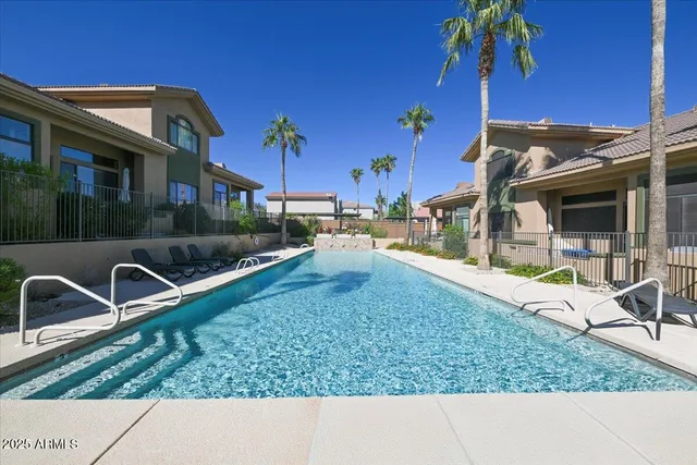 a backyard of a house with barbeque oven