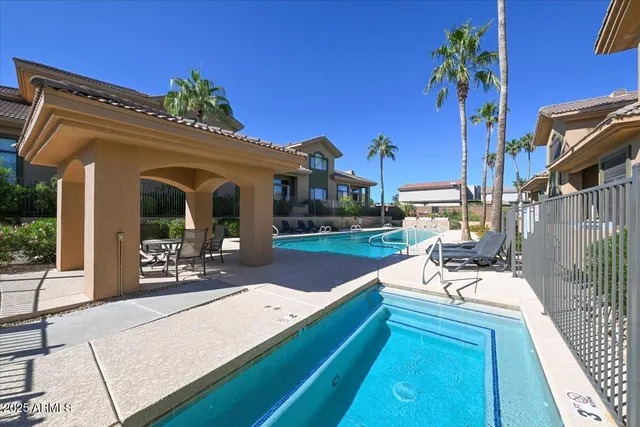 a view of a house with backyard porch and sitting area