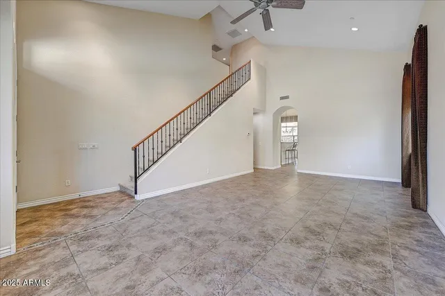 a view of an empty room with stairs