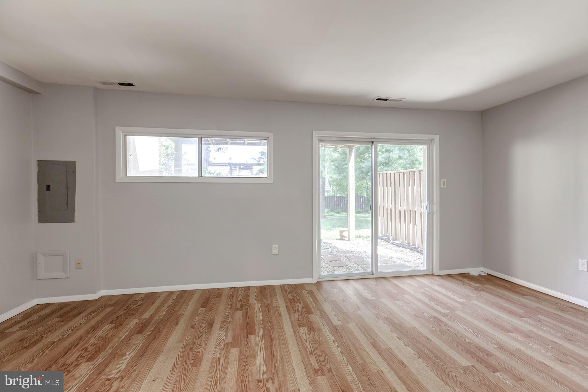 1649 Valencia Way Reston, VA 20190 - Photo 22 of 26 a view of empty room with wooden floor and fan
