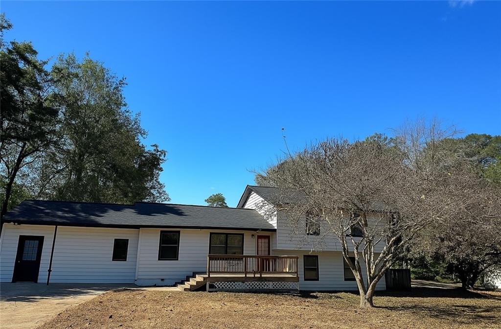 1757 Litchfield Road Southwest Snellville, GA 30078 - Photo 1 of 17 a front view of a house with a yard
