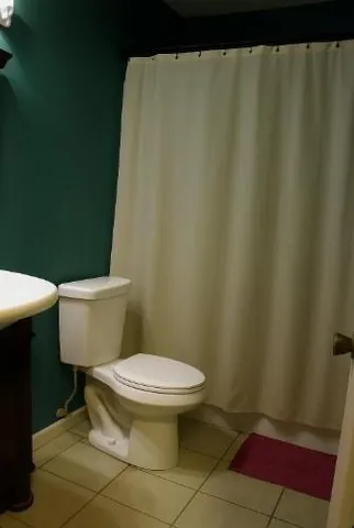 a bathroom with a toilet and a sink