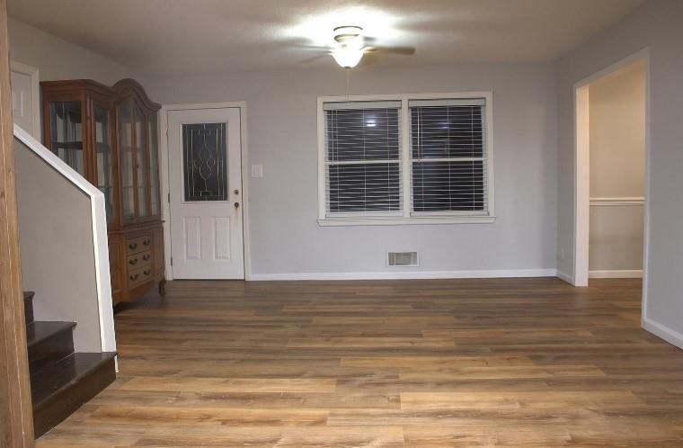 1757 Litchfield Road Southwest Snellville, GA 30078 - Photo 2 of 17 a view of an empty room with wooden floor and a window