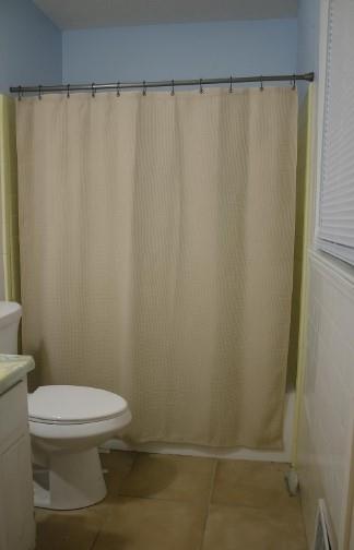 1757 Litchfield Road Southwest Snellville, GA 30078 - Photo 10 of 17 a white toilet sitting next to a shower