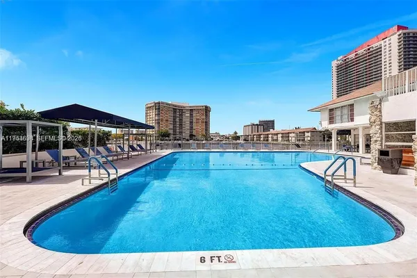 a view of a swimming pool with a lounge chair