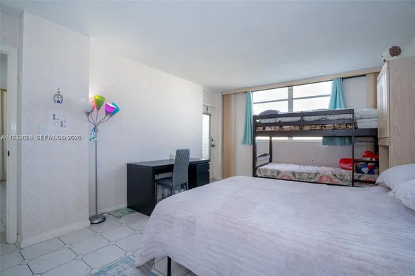 a bedroom with a bed and a cabinets