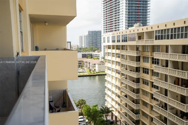 a view of a balcony with a floor to ceiling window