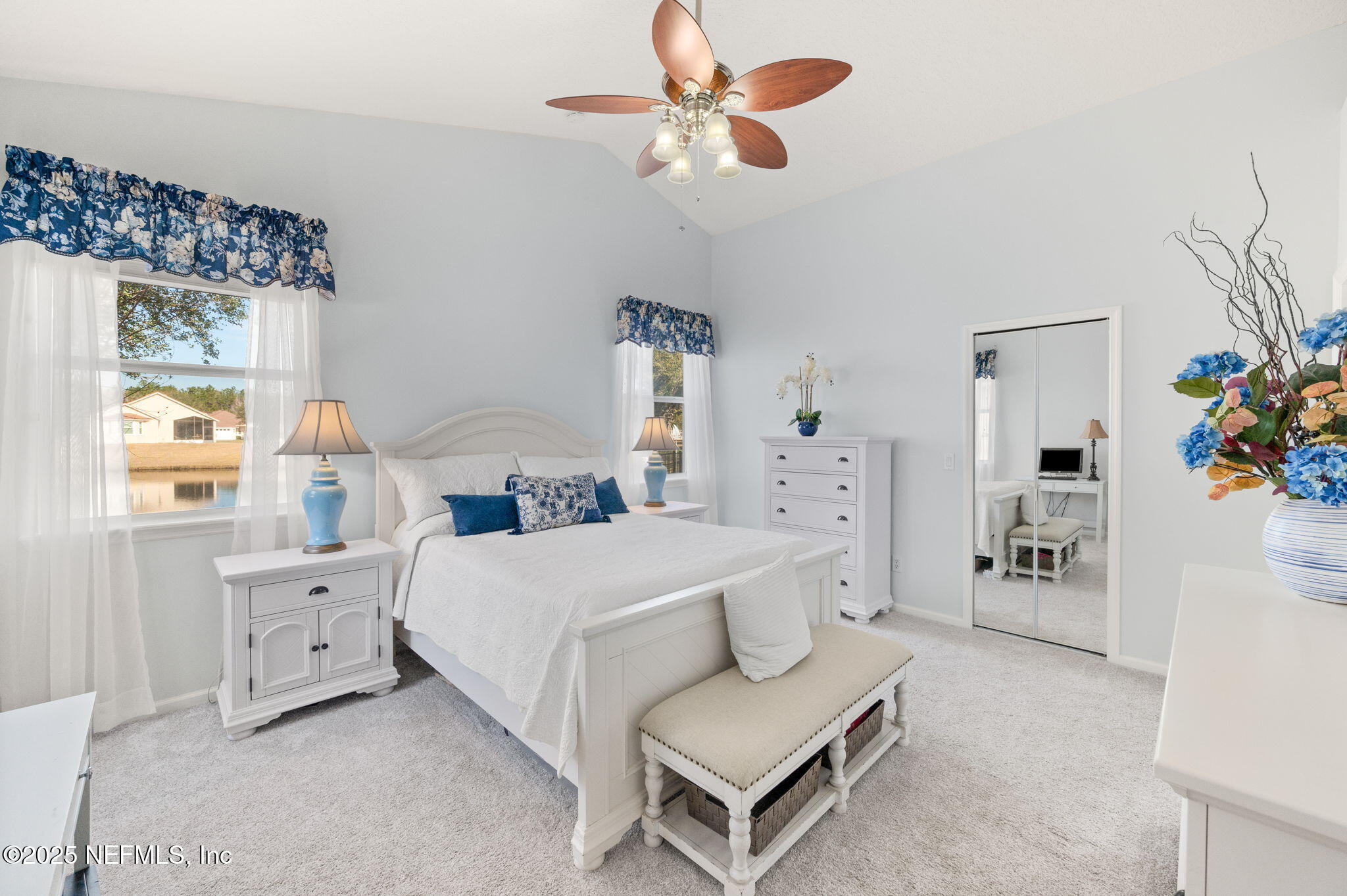 697 Copperhead Circle St. Augustine, FL 32092 - Photo 12 of 26 a bedroom with a bed and a chandelier