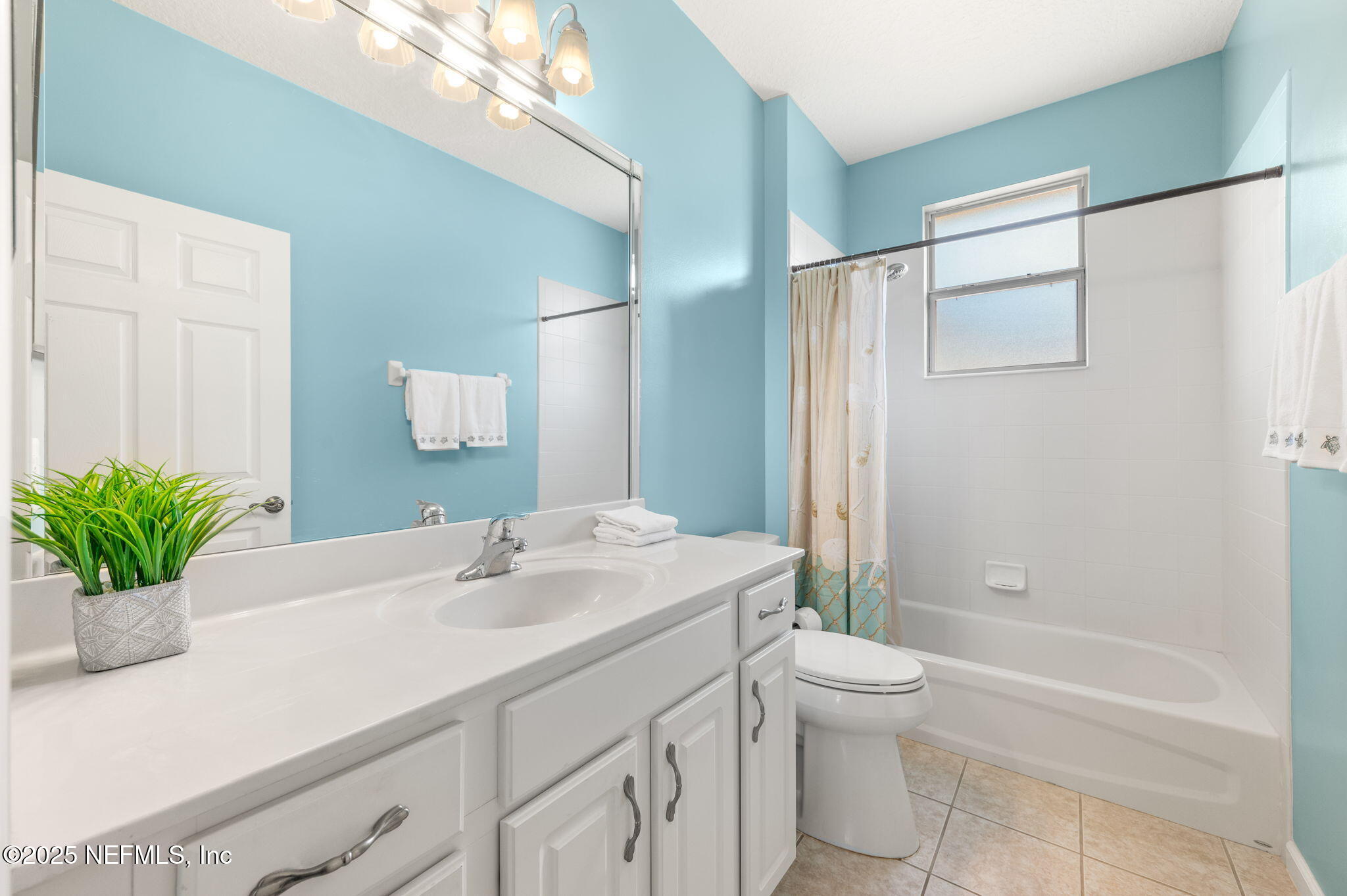 697 Copperhead Circle St. Augustine, FL 32092 - Photo 17 of 26 a bathroom with a sink a toilet and shower