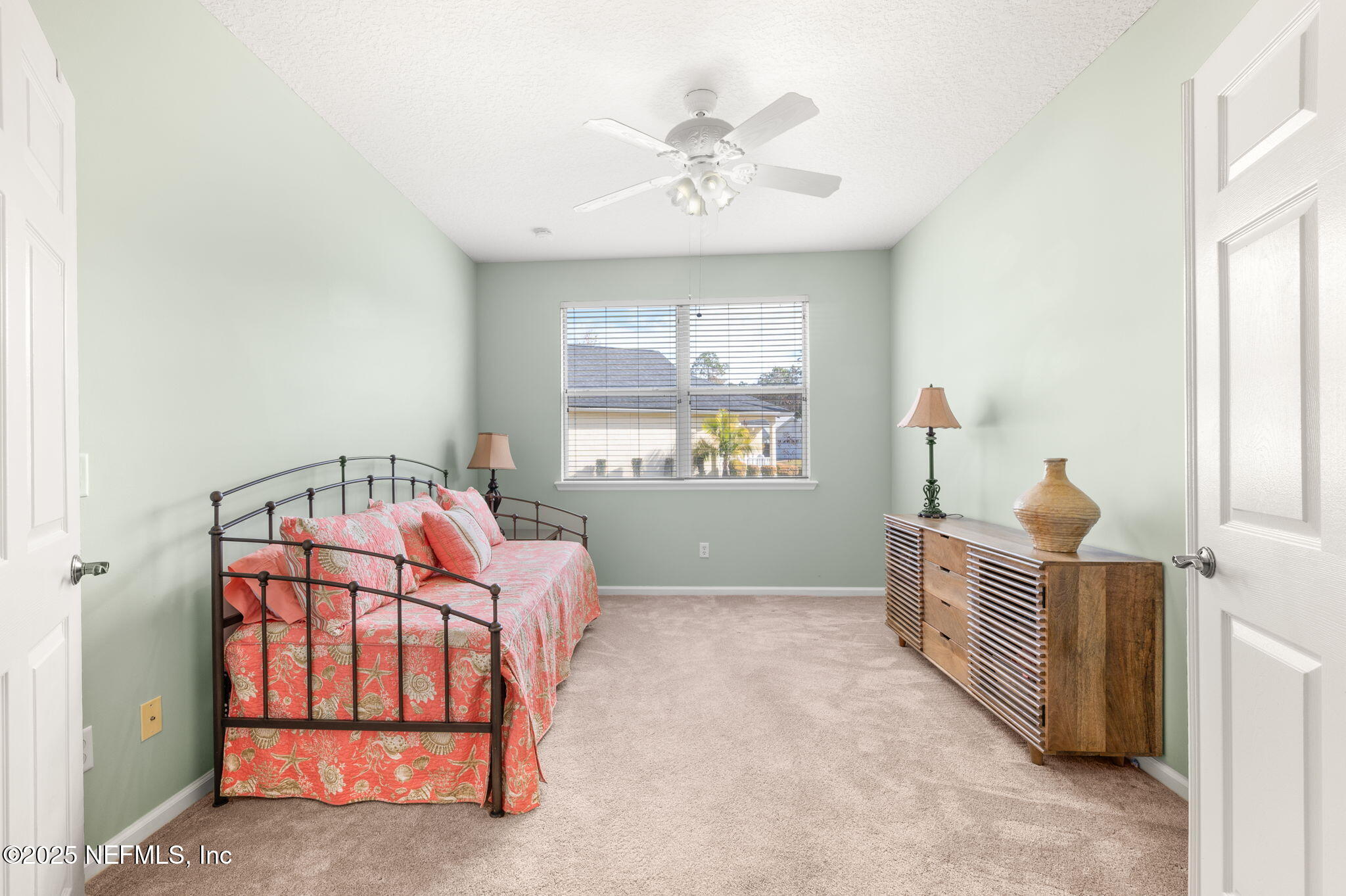 697 Copperhead Circle St. Augustine, FL 32092 - Photo 18 of 26 a bedroom with a bed and a window