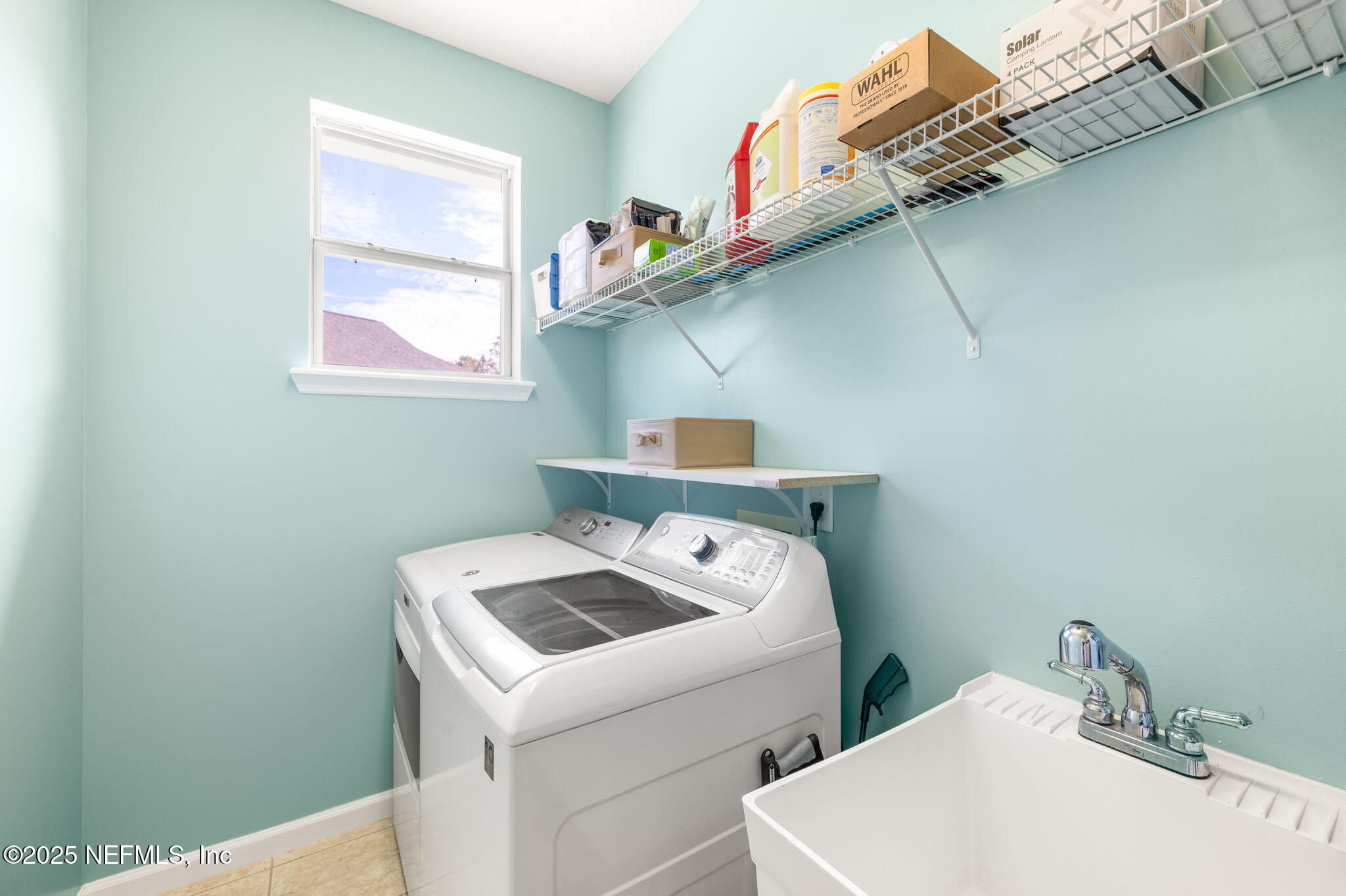 697 Copperhead Circle St. Augustine, FL 32092 - Photo 19 of 26 a utility room with dryer and washer
