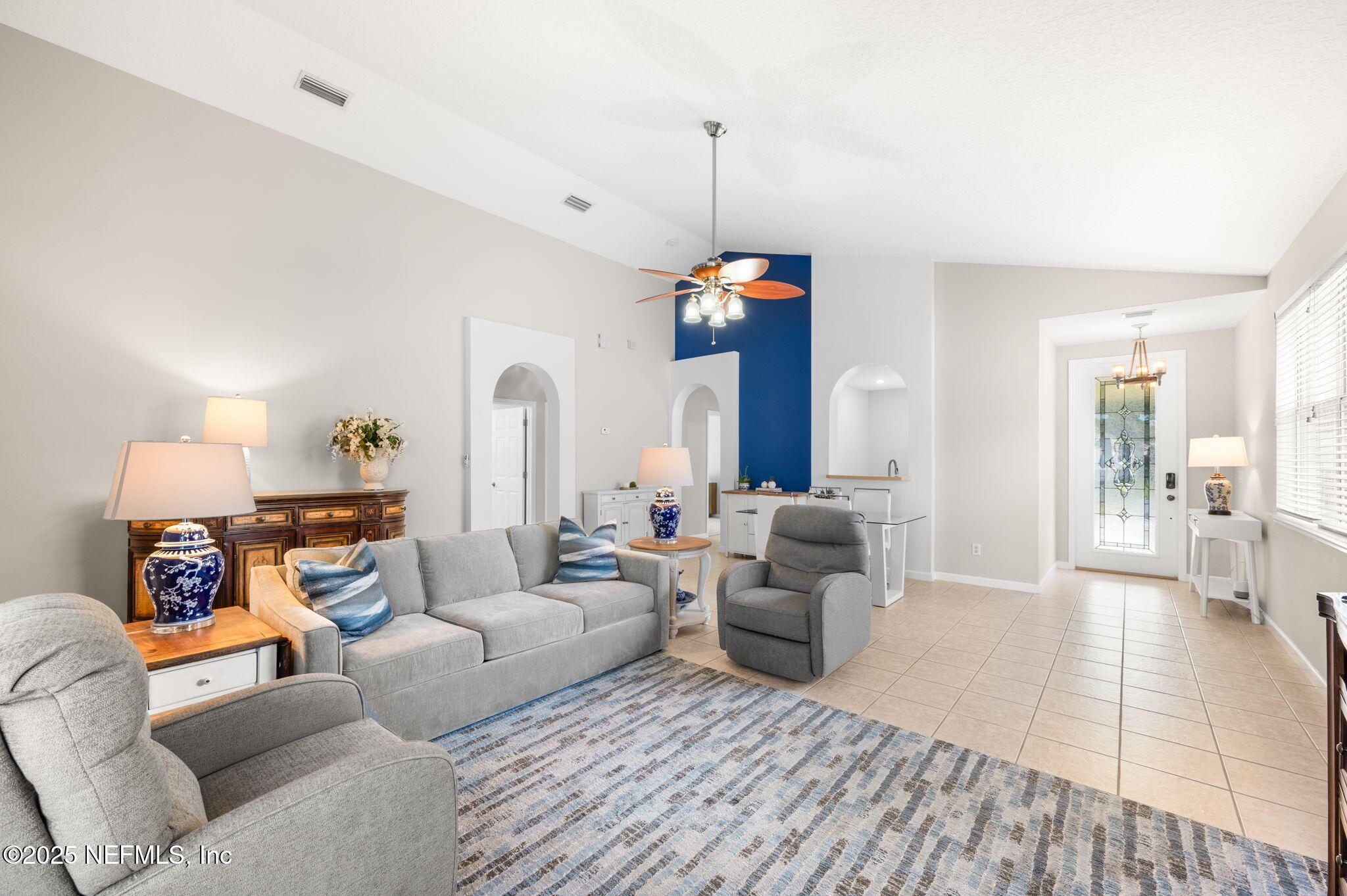 697 Copperhead Circle St. Augustine, FL 32092 - Photo 6 of 26 a living room with furniture and a fireplace