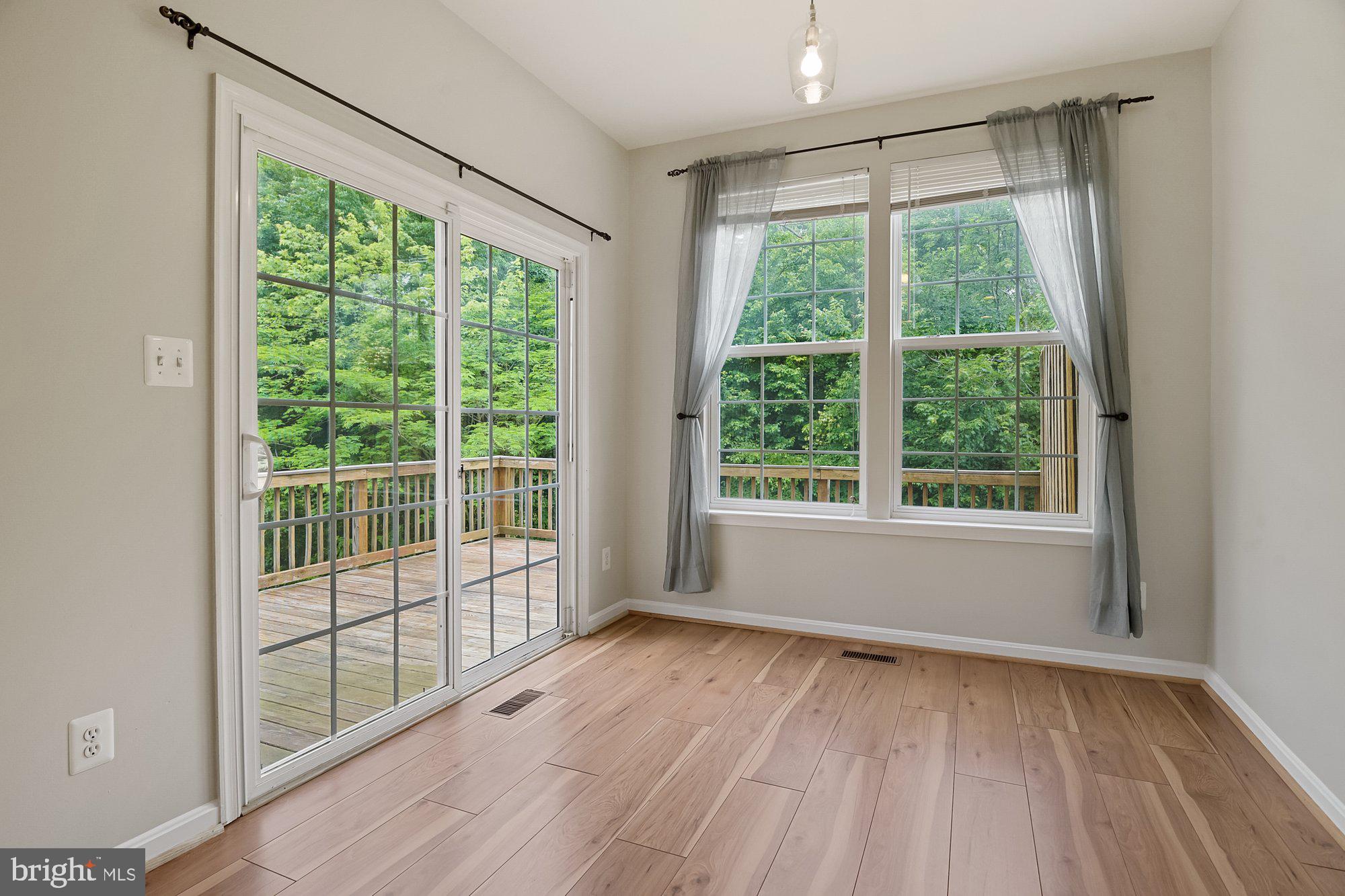 1948 Waltman Road Edgewood, MD 21040 - Photo 8 of 32 Light-filled sunroom overlooks deck & woods