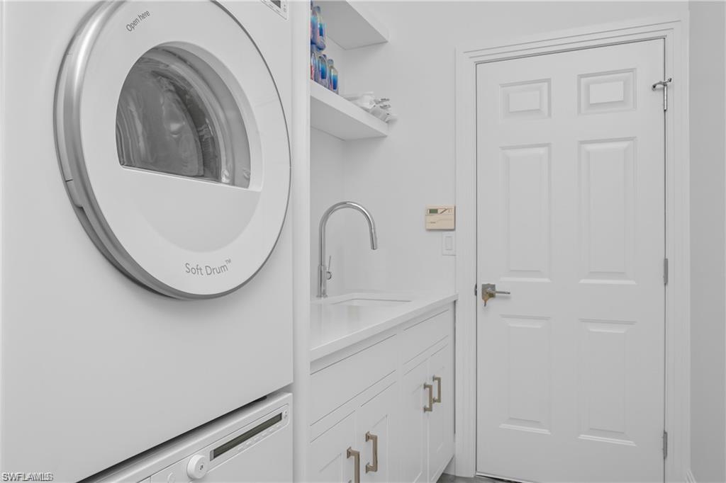 8967 Lely Island Circle Naples, FL 34113 - Photo 35 of 46 a close view of a sink in a bathroom