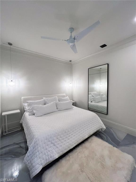 8967 Lely Island Circle Naples, FL 34113 - Photo 38 of 46 a bedroom with a bed and a lamp