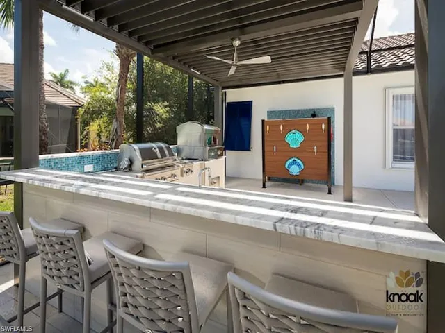 a kitchen with a table and chairs