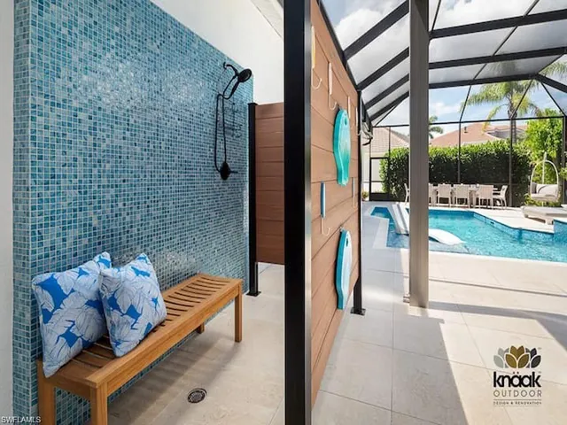 a view of living room kitchen and entryway