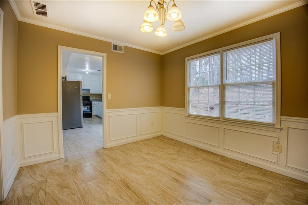 1457 Cherry Hill Road Southwest Conyers, GA 30094 - Photo 8 of 31 wooden floor in an empty room with a window