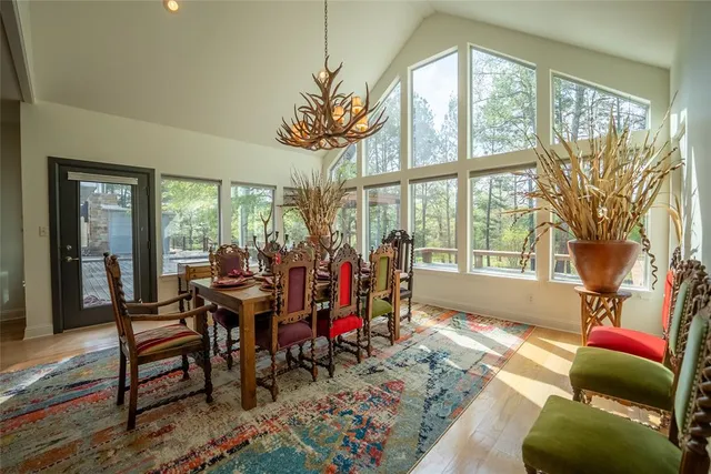 a view of a livingroom with furniture and a large window