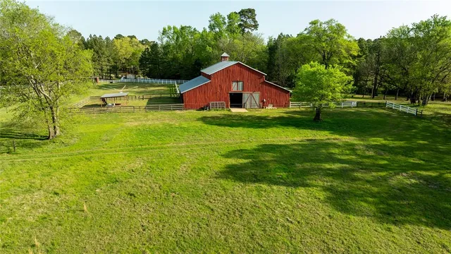 an aerial view of a house having yard